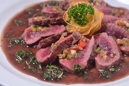 Seared Lamb Loin Filled with Mini Vegetable Ratatouille   Served with Potato Rosette & Rosemary Lamb Jus